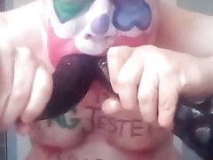 Fag Jester Stuffing its Cock-Whore Mouth with Dildos