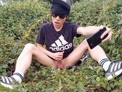 Adorable French-Asian twink Jon Arteen jerks off his smooth cock outdoors, leaving thick cum on his fingers