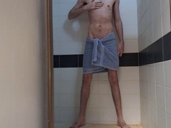 Slim twink Esteban Williams shows off his big cock while getting off in the bathroom