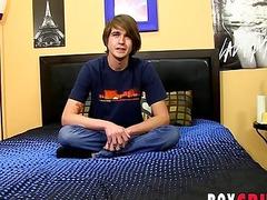 Handsome twink strips during an interview and jerks off solo