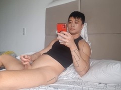 Handsome dude strokes his cock in a steamy morning solo session