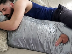 Bearded dom using mummified boy as a toy