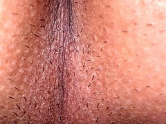 A close-up view of the man's asshole down to every wrinkle