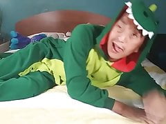 Horny Asian guy jacking off wearing furry dinosaur onesie. C