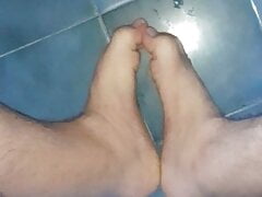 I masturbate my cock and play with my feet