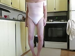 Male slut in a leotard shows his fem ass cheeks.