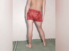 Hot guy tries on red boxers and poses sexy in them