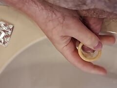 Peeing into a condom - try to let it burst