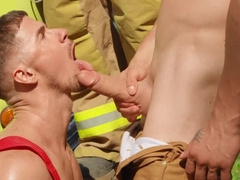 Hunks are having a threesome next to the big vehicle