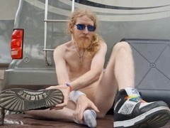 Bearded ginger nudist finishes outside and plays with his soles