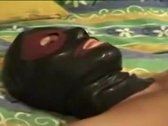 Masturbating with a mask on the face
