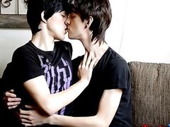 Two young men with long hair jerking each other off hard