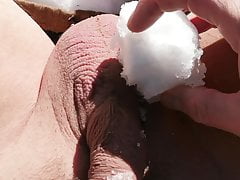 Playing with Snow On Cock, Balls, and Pierced Nipple