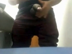 Brazilian Daddy Strokes His Big Uncut Cock at Work
