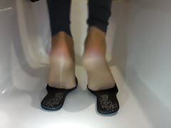 Feet in flat leather pantalets with nylons & black toe nails