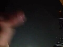 Kon Dix big cock shoots a load of cum on a black table