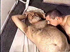 A junior men and elder man toying with each other dick