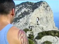 Hot black and white gay studs relax outdoors together