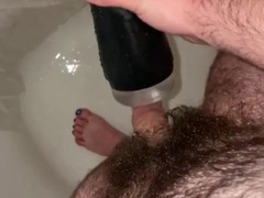 Young fur covered parent plays with flashlight in douche