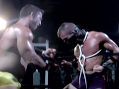 Muscular male slave is captive and set to endure merciless cock in ass