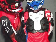 A guy in a motocross gear gets a portion on his mxhelmet