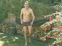 Guy jerks off and fingers his hole in the back yard before finally cumming onto the grass