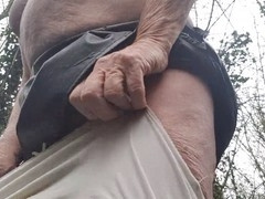 Mature Colleen showing off her milky knickers while wearing a hooter-sling outdoors