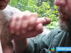 Older guy has fun sucking a younger guys cock in the park 3