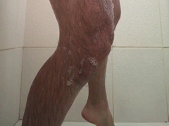 Tabby versatile cat taking a bathtub and paying for soap