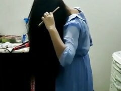 Indian girl with long black hairs combing