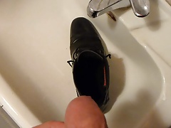 Piss in men's dress shoe