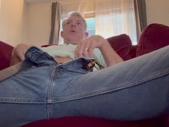 Horny hairy DILF pleasures himself on the couch