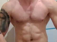 Muscular jock indulges in muscle worship and strokes his throbbing cock