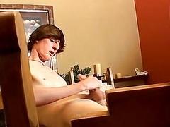 Twink oils his throbbing cock up before tugging on it