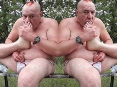 Chubby bears enjoy foot worship and handjob outdoors