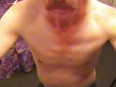 Mature gay slut with long hair and a mustache is going down on a boner