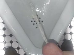 Faggot pissing in urinal and licking it up
