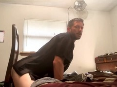 Tightly toned ass gets played with a hefty dildo