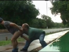 father and dude porking outdoor near road