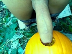 Sexy twink passionately pounds a pumpkin in the garden