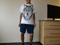 Asian showing off black shorts and blue underwear briefs