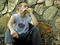Skinny gay dude smoking outdoors before stripping and jerking off