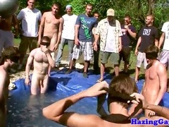 Here college guys hazed outdoors