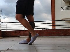 Latino shows his socks OUTDOOR ( Big feet)