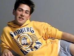 Dashing twink relaxes while smoking and tugs on his cock