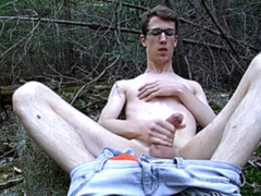 Geeky twink Sacha West jacking his cock outdoors