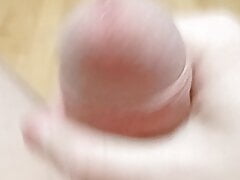 Guy jerking off uncircumcised cock on the table