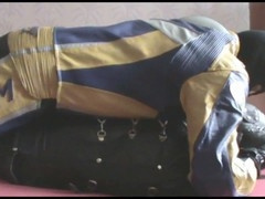 the slave in sleepsack with master in bikersuit