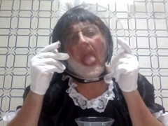 Sissy gets humiliated in a uniform while swallowing cum