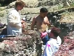 After paint, gay studs have outdoor group sex